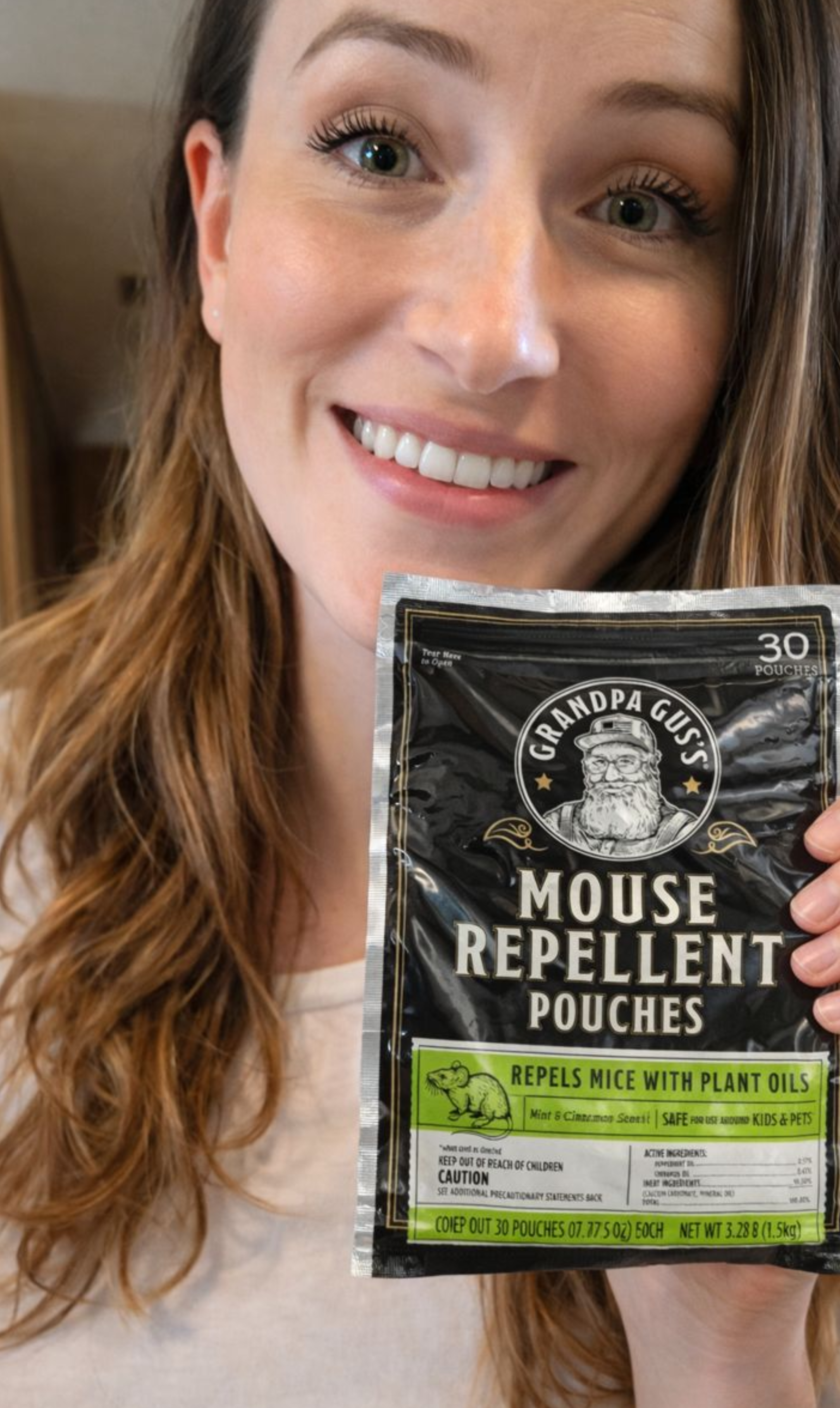 person holding Grandpa Gus's Mouse Repellant